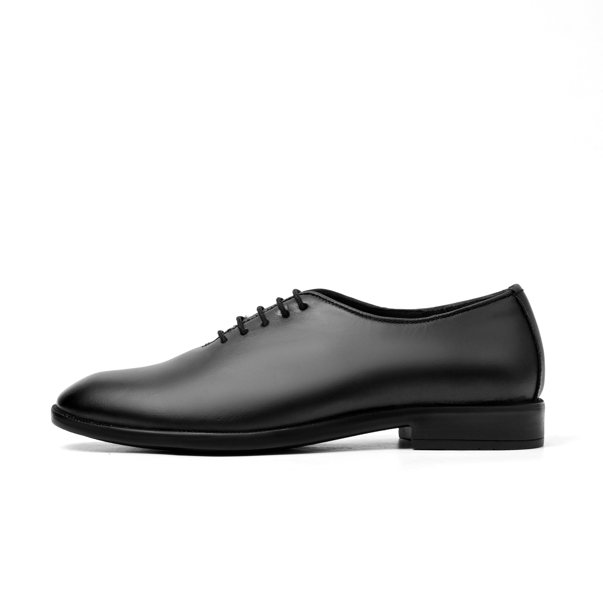 Black leather shoe on a white background