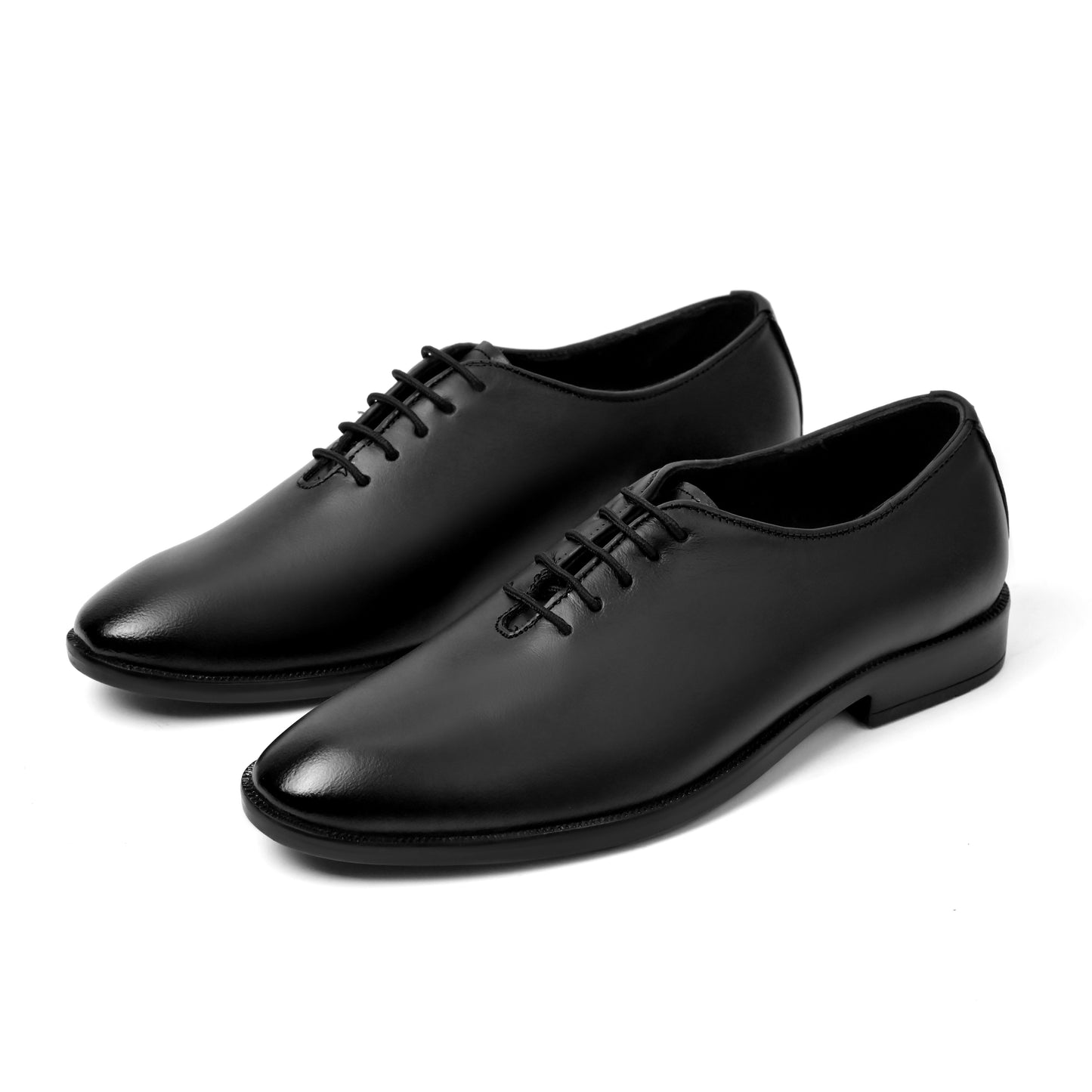 Dagga Pair of black dress shoes on a white background